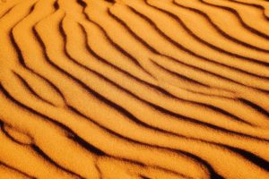 brown sand with shadow of person