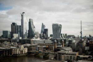 city buildings near body of water during daytime