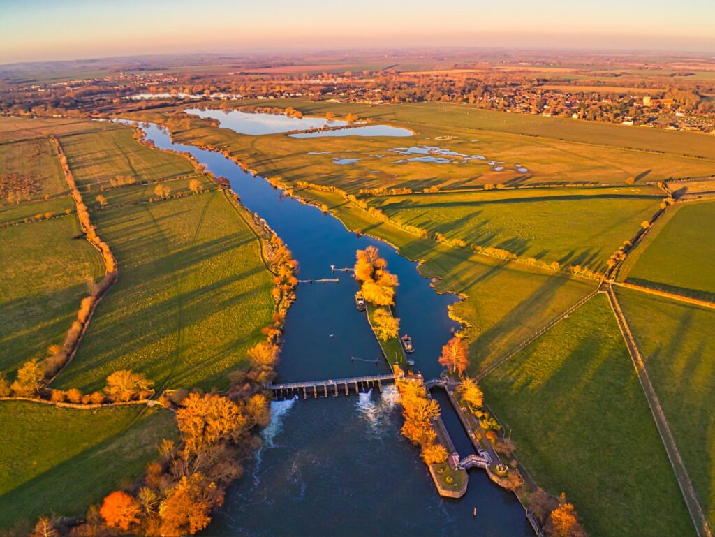 aerial photography of river and open field during daytime