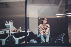 woman sitting on chair beside table