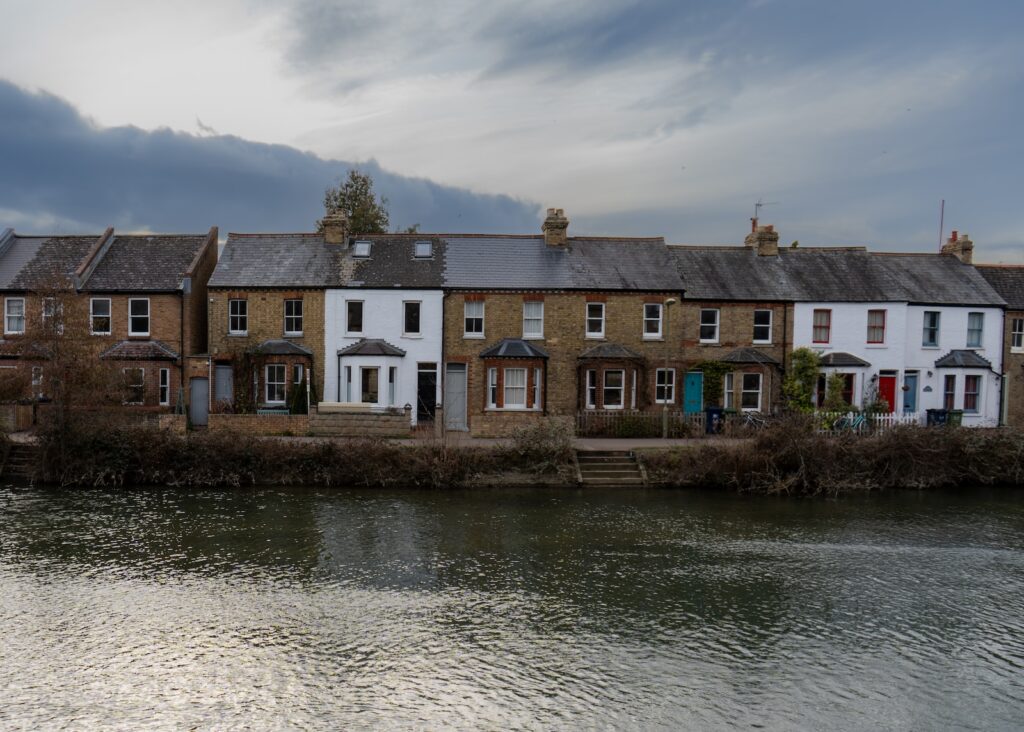 a row of houses next to a body of water