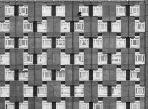 a black and white photo of a building with windows