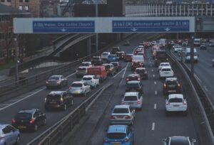 cars on road near bridge during daytime