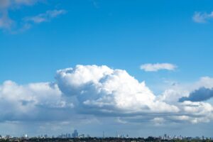 A view of a body of water with a city in the background
