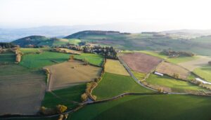 An aerial view of a green hilly area
